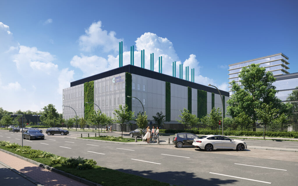 Modern data center conference room with a large meeting table, office chairs, and glass walls.